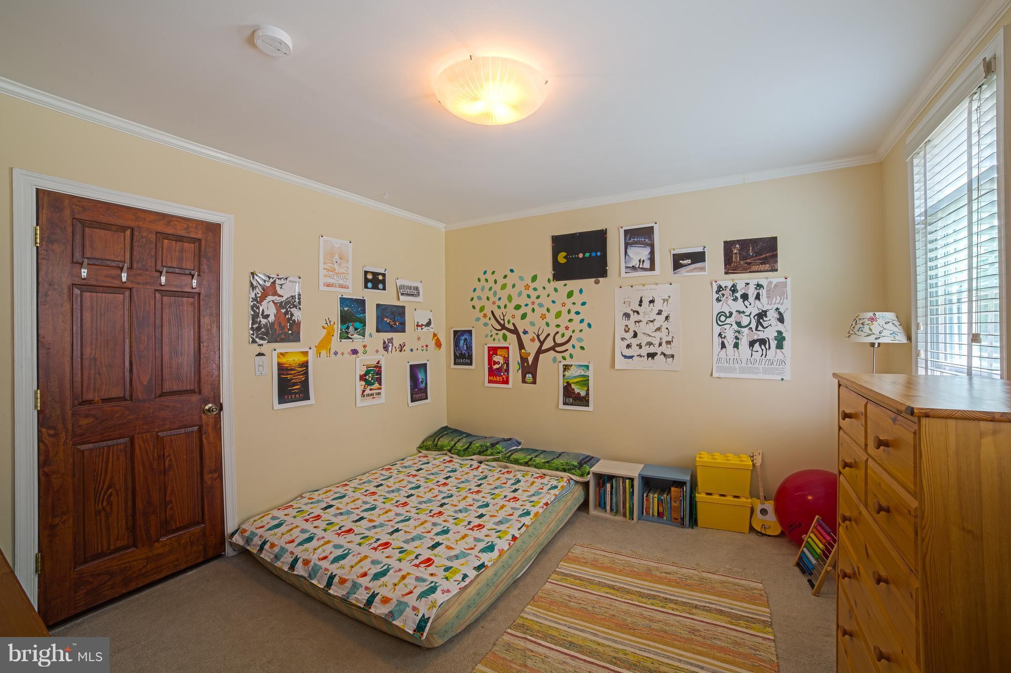 4535 Keswick Road Baltimore, MD 21210 - Photo 20 of 30 a bedroom with a bed and wooden floor