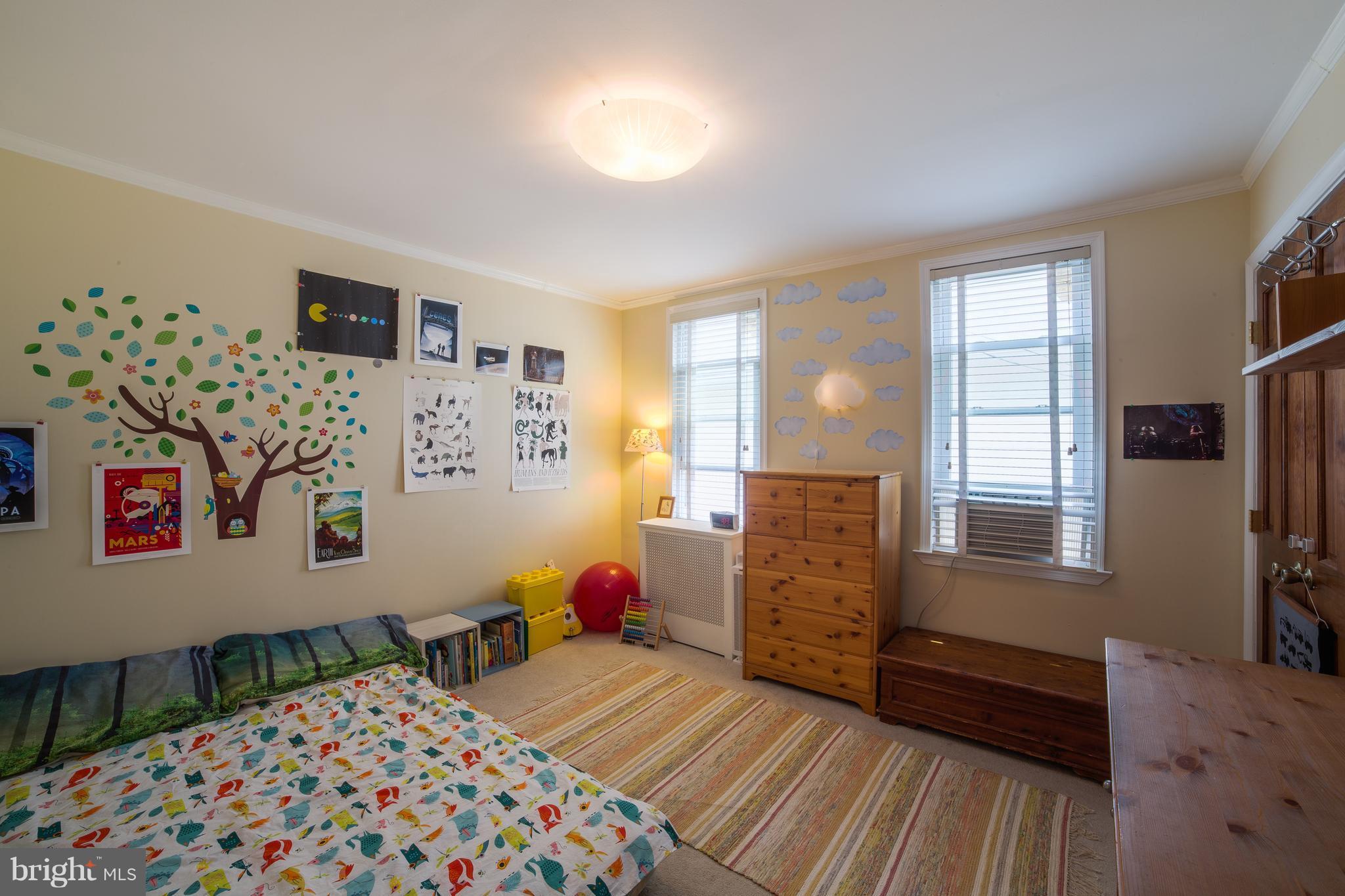 4535 Keswick Road Baltimore, MD 21210 - Photo 21 of 30 a bedroom with furniture and a window