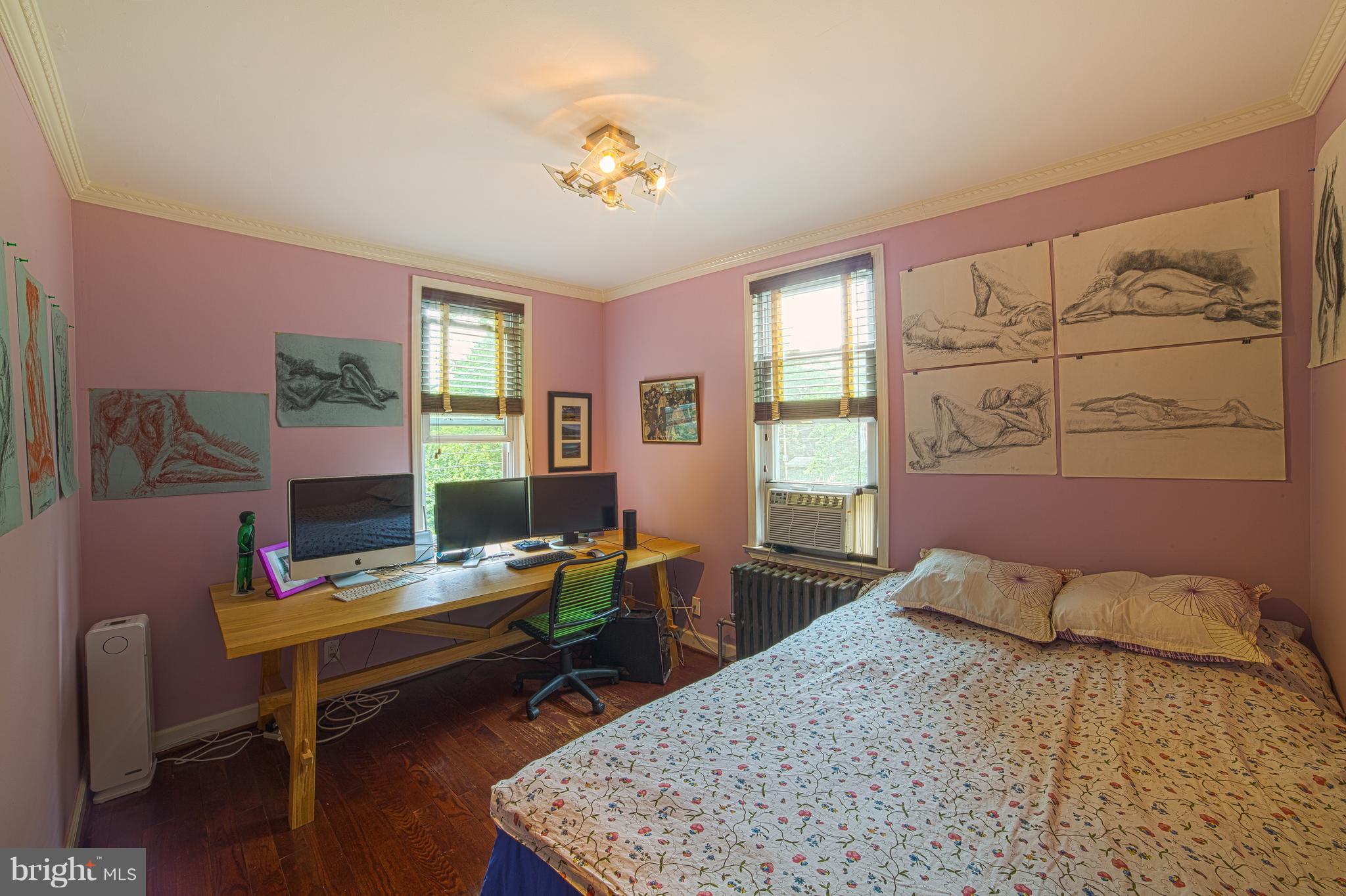 4535 Keswick Road Baltimore, MD 21210 - Photo 23 of 30 a bed room with a bed and a table
