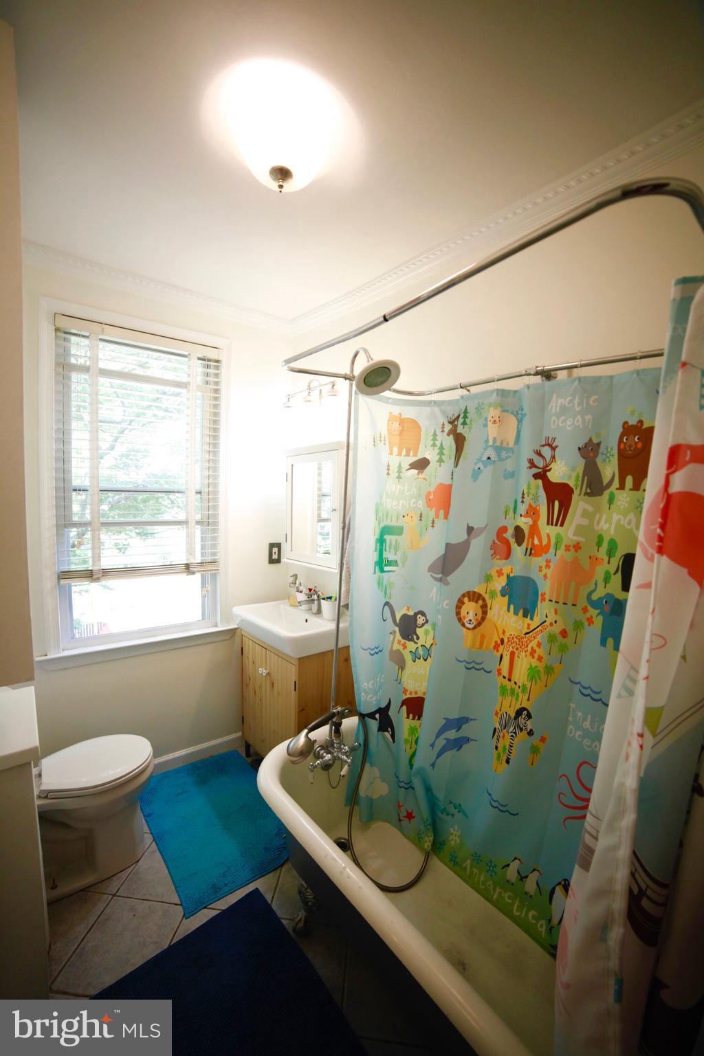 4535 Keswick Road Baltimore, MD 21210 - Photo 25 of 30 a bathroom with sink and mirror