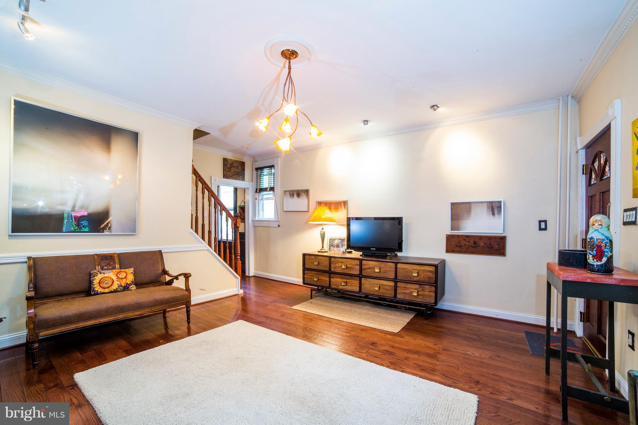 4535 Keswick Road Baltimore, MD 21210 - Photo 4 of 30 a living room with furniture and wooden floor