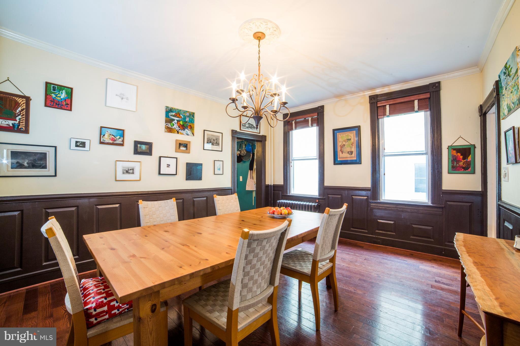 4535 Keswick Road Baltimore, MD 21210 - Photo 10 of 30 a view of a dining room with furniture window and wooden floor
