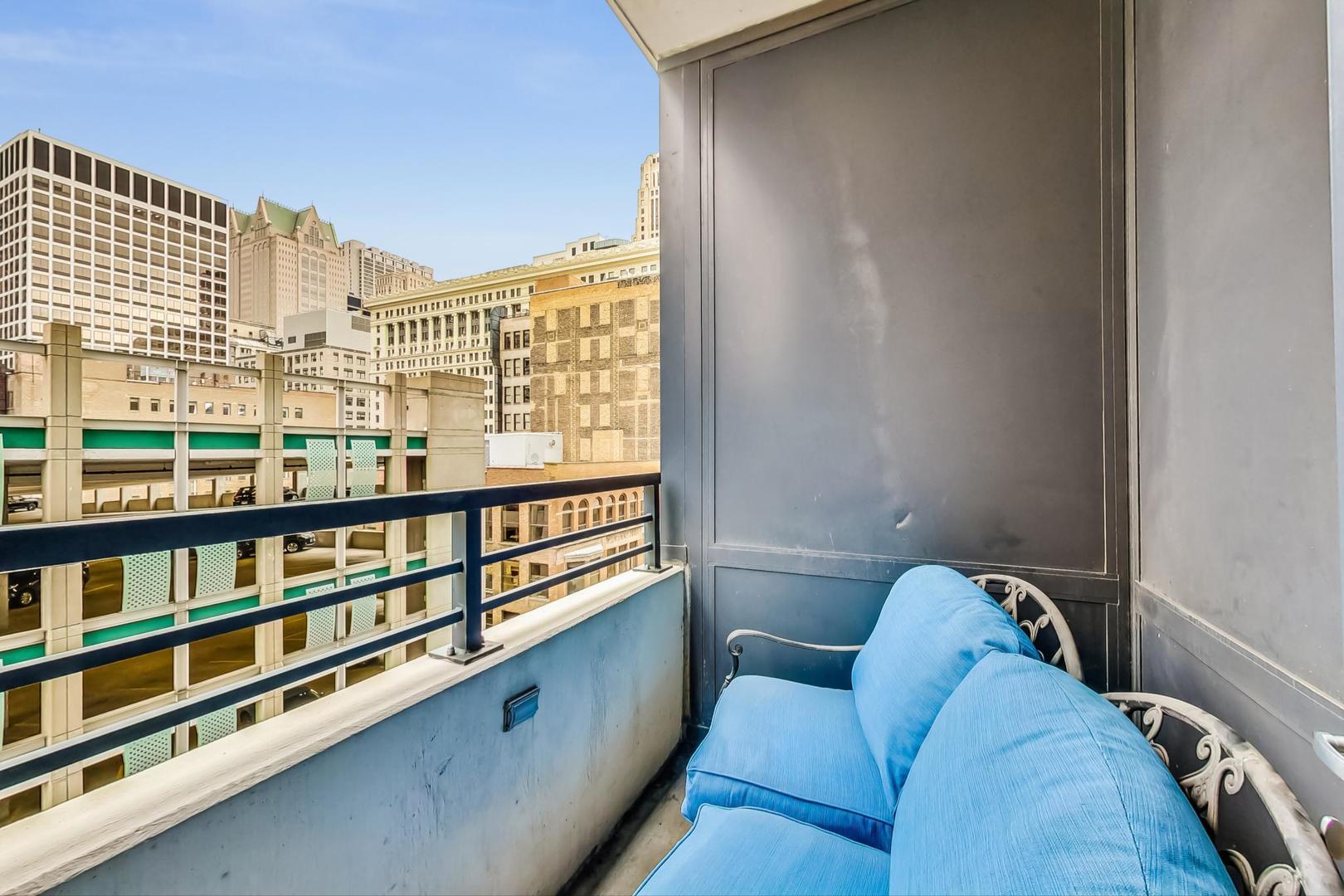 235 West Van Buren Street, Unit 1517 Chicago, IL 60607 - Photo 10 of 15 a view of a living room and a window
