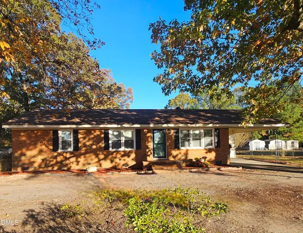 a bedroom with a bed and a ceiling fan