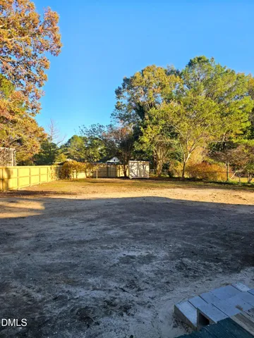 a view of backyard and tree