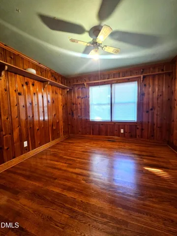 a bathroom with a granite countertop sink and a large mirror