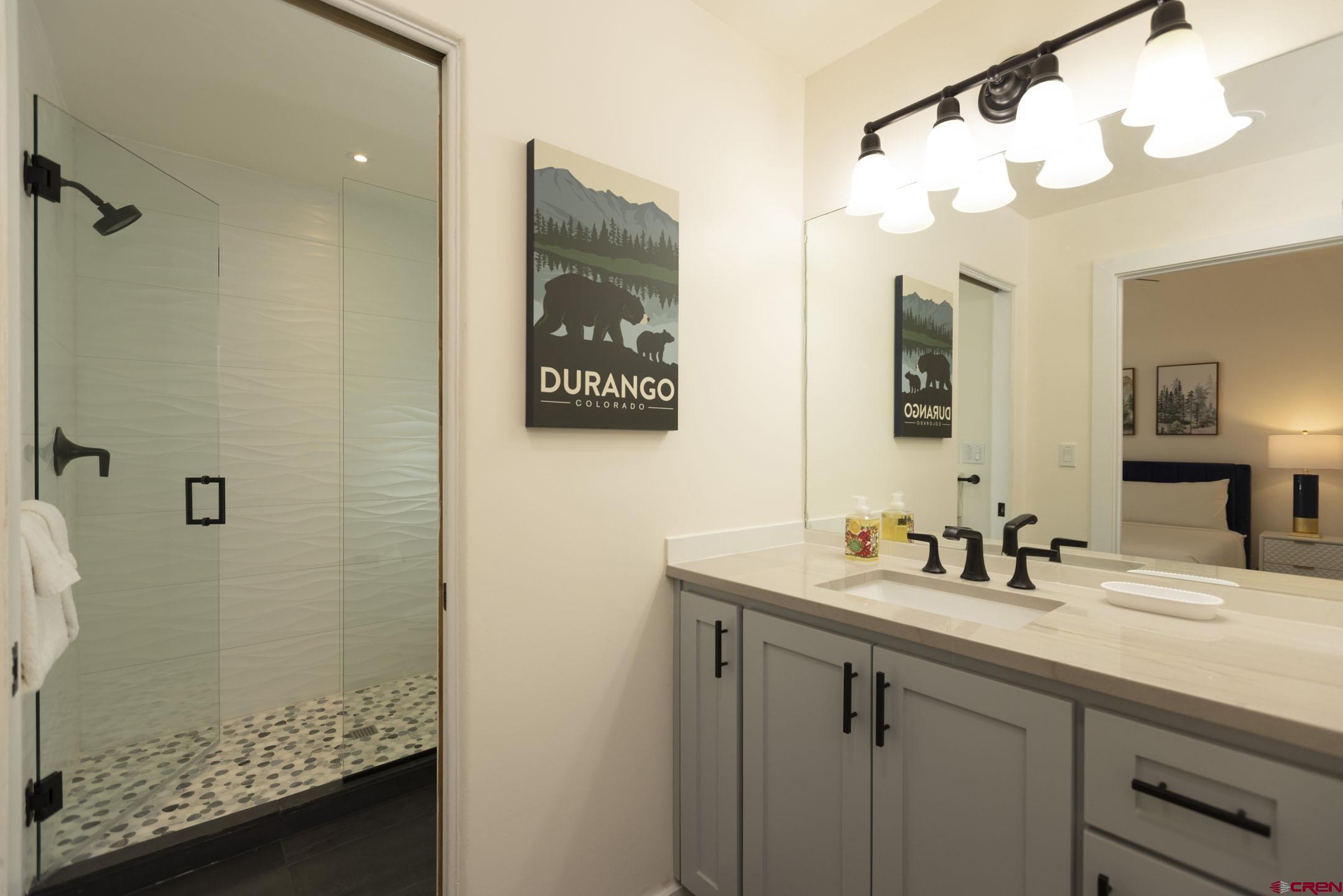 117 Needles Way, Unit 720 Durango, CO 81301 - Photo 21 of 33 a bathroom with a sink and a mirror