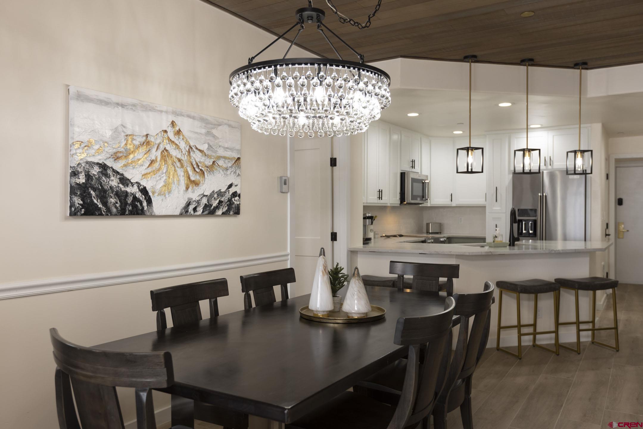 117 Needles Way, Unit 720 Durango, CO 81301 - Photo 6 of 33 a large kitchen with a table and chairs