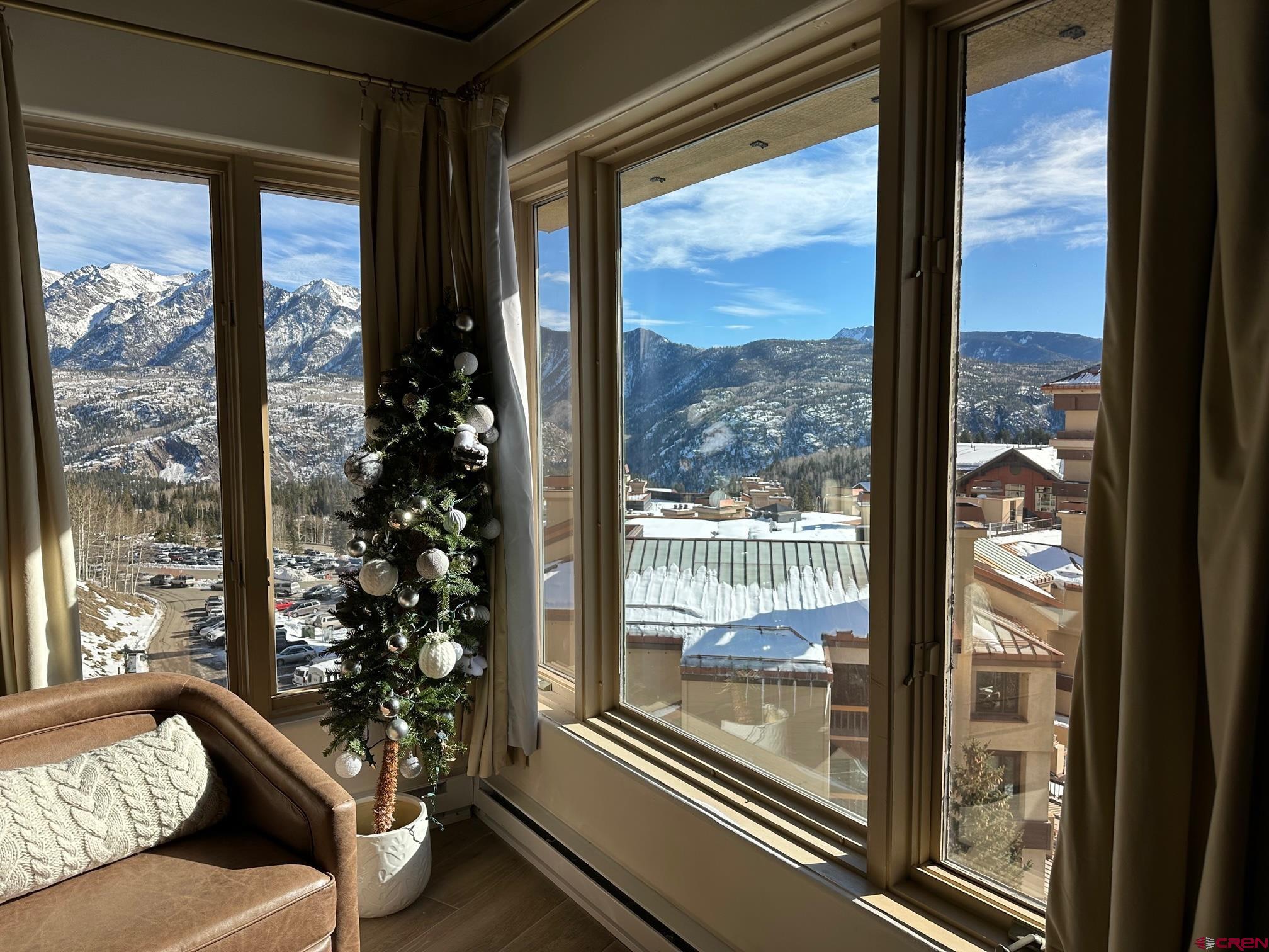 117 Needles Way, Unit 720 Durango, CO 81301 - Photo 9 of 33 a living room with furniture and a floor to ceiling window