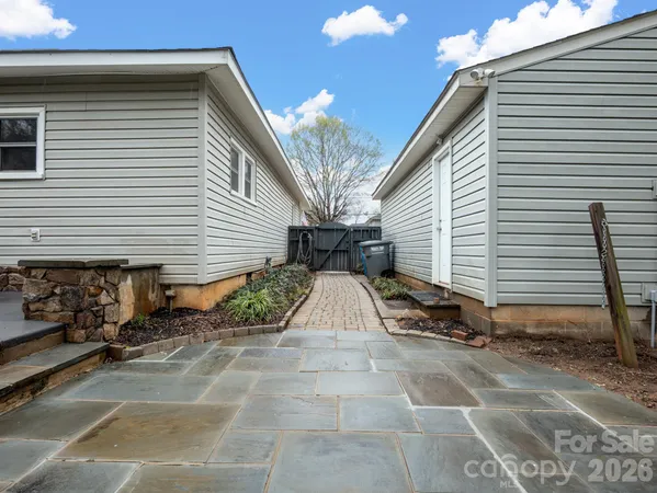 a view of backyard with sitting area