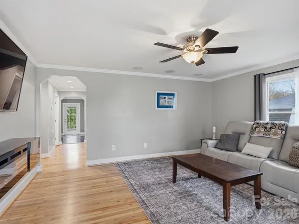a living room with furniture and a rug