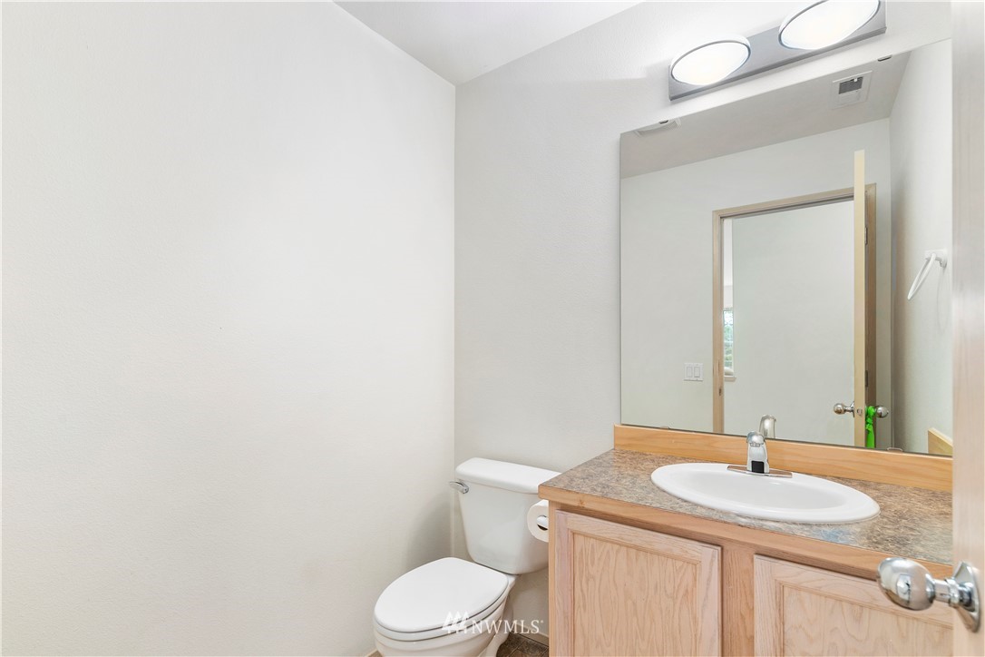 2913 Southeast 4th Street Renton, WA 98056 - Photo 14 of 36 a bathroom with a sink a toilet and mirror