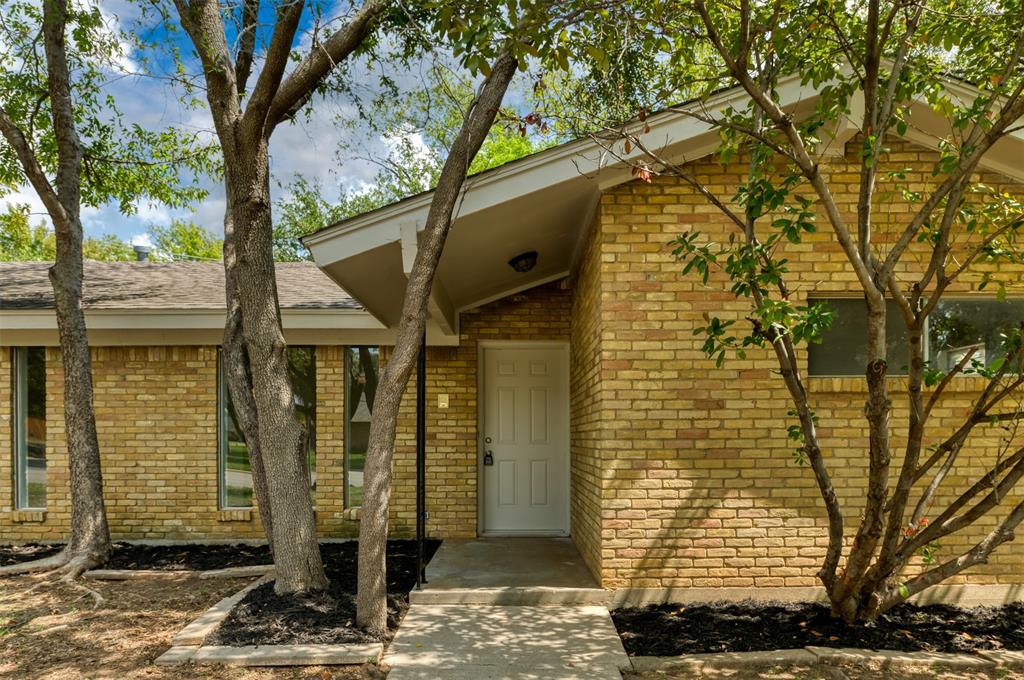 a front view of a house with street