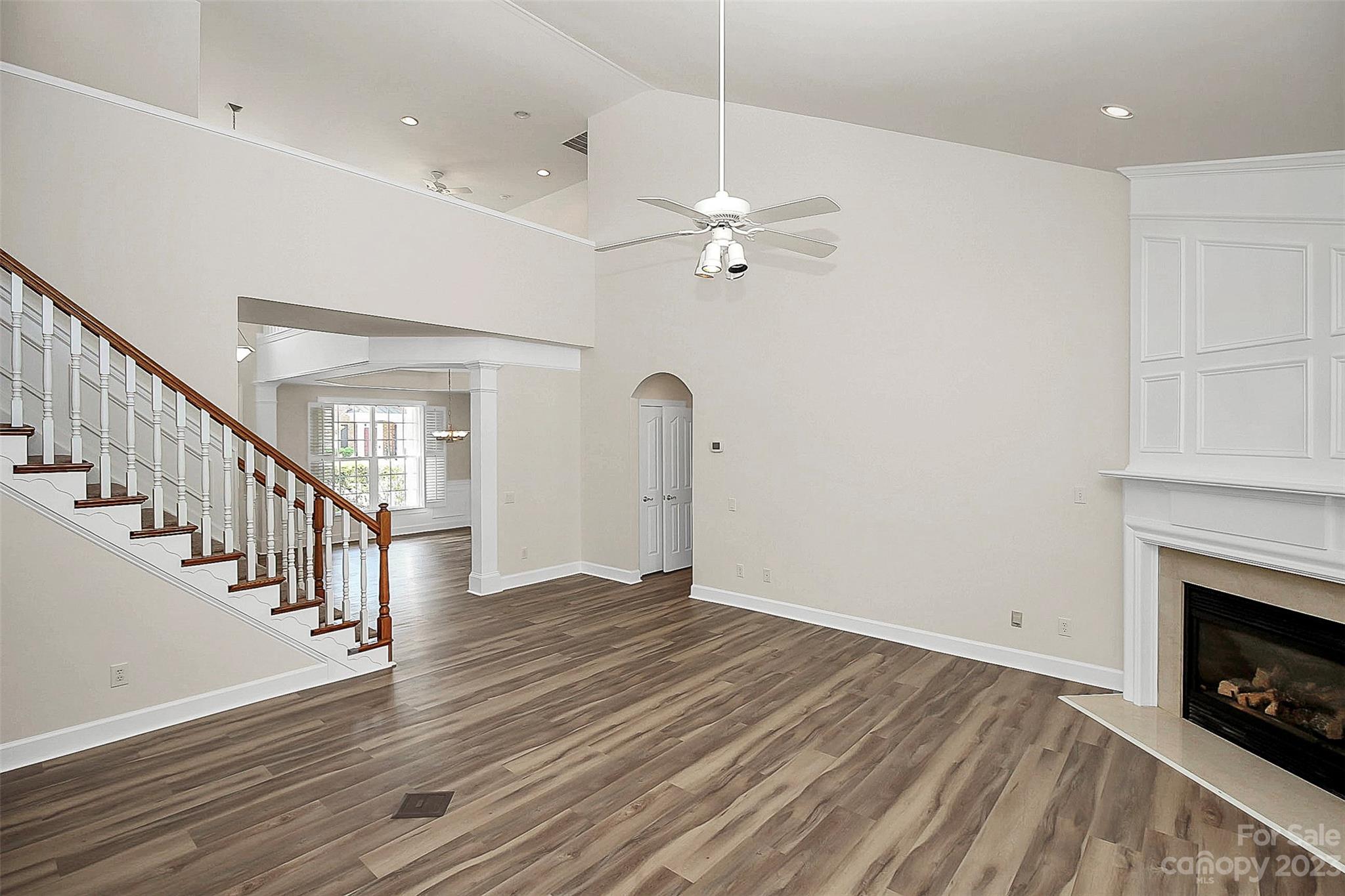218 Robinlynn Road Matthews, NC 28105 - Photo 12 of 24 a view of an empty room with wooden floor fireplace and a window
