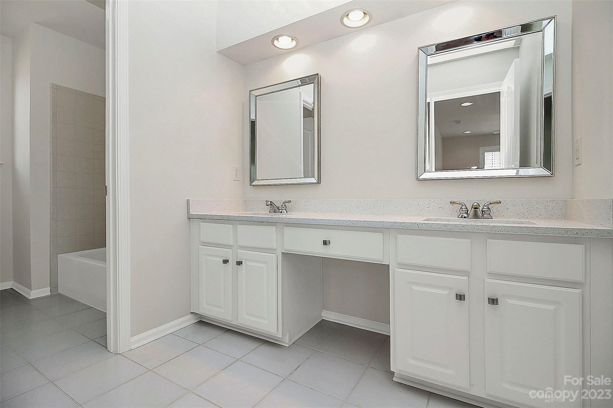 218 Robinlynn Road Matthews, NC 28105 - Photo 16 of 24 a bathroom with a double vanity sink mirror and