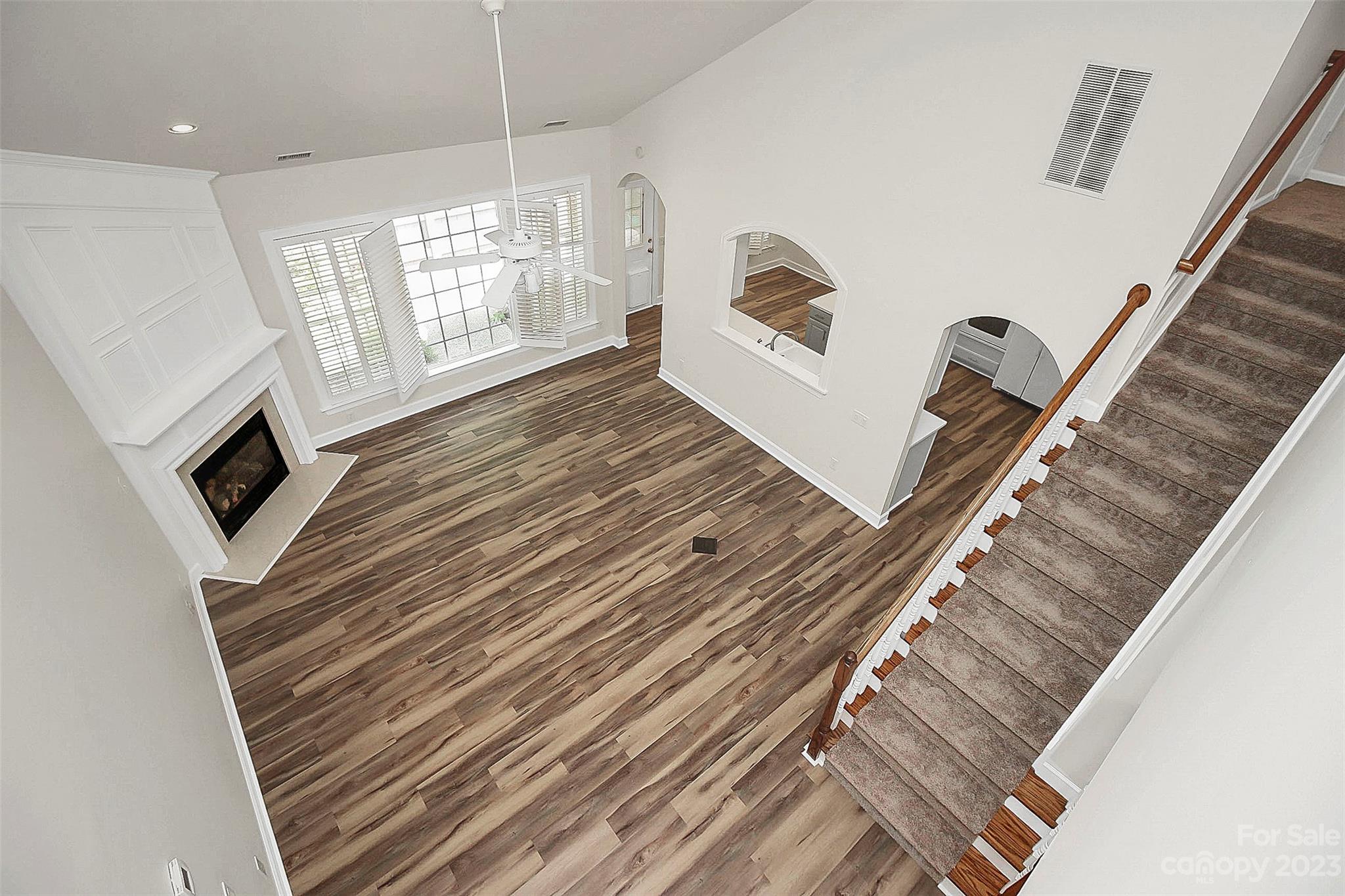218 Robinlynn Road Matthews, NC 28105 - Photo 17 of 24 a view of a living room with furniture and a fireplace