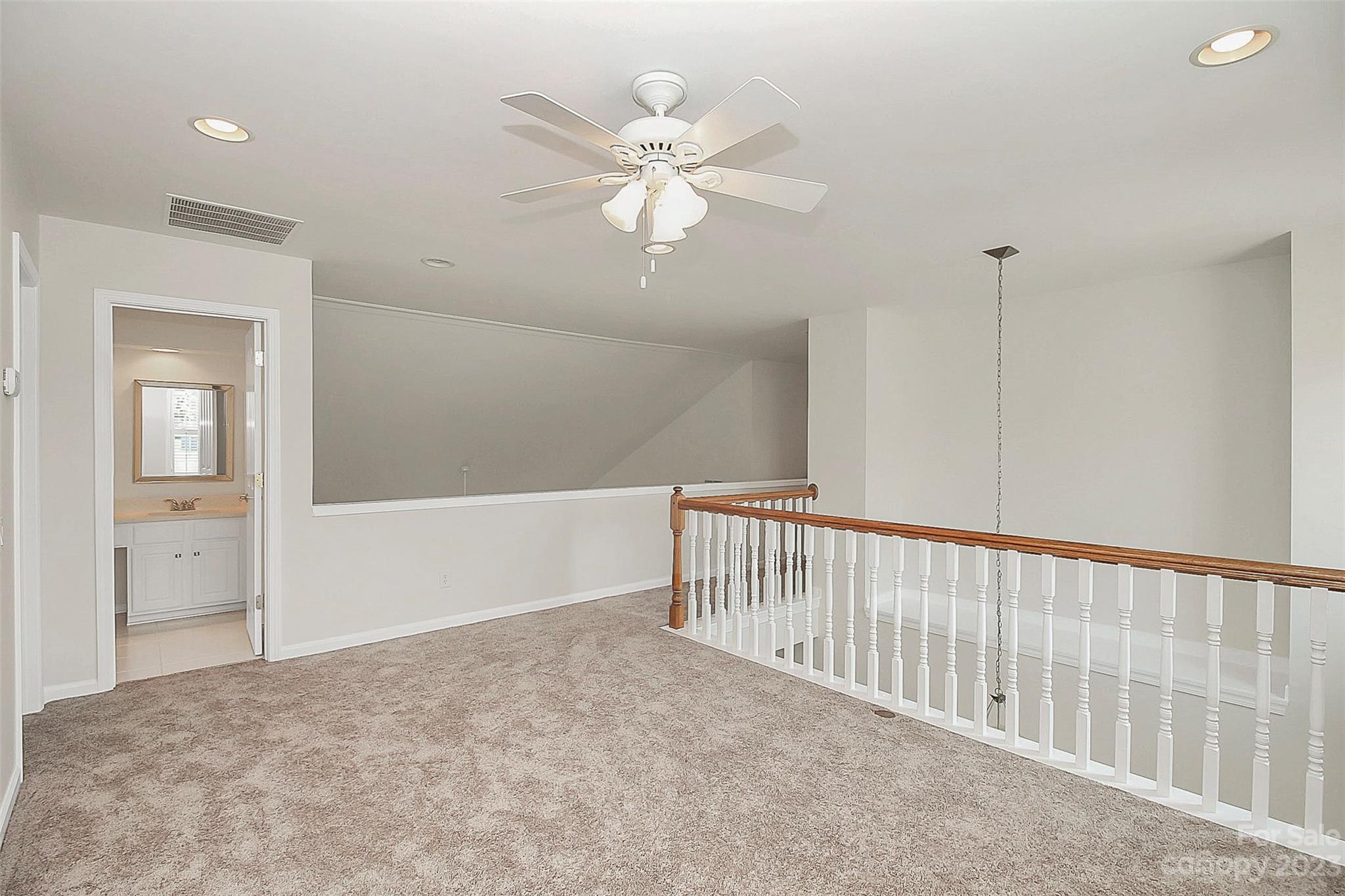 218 Robinlynn Road Matthews, NC 28105 - Photo 18 of 24 a view of a livingroom with a ceiling fan and window