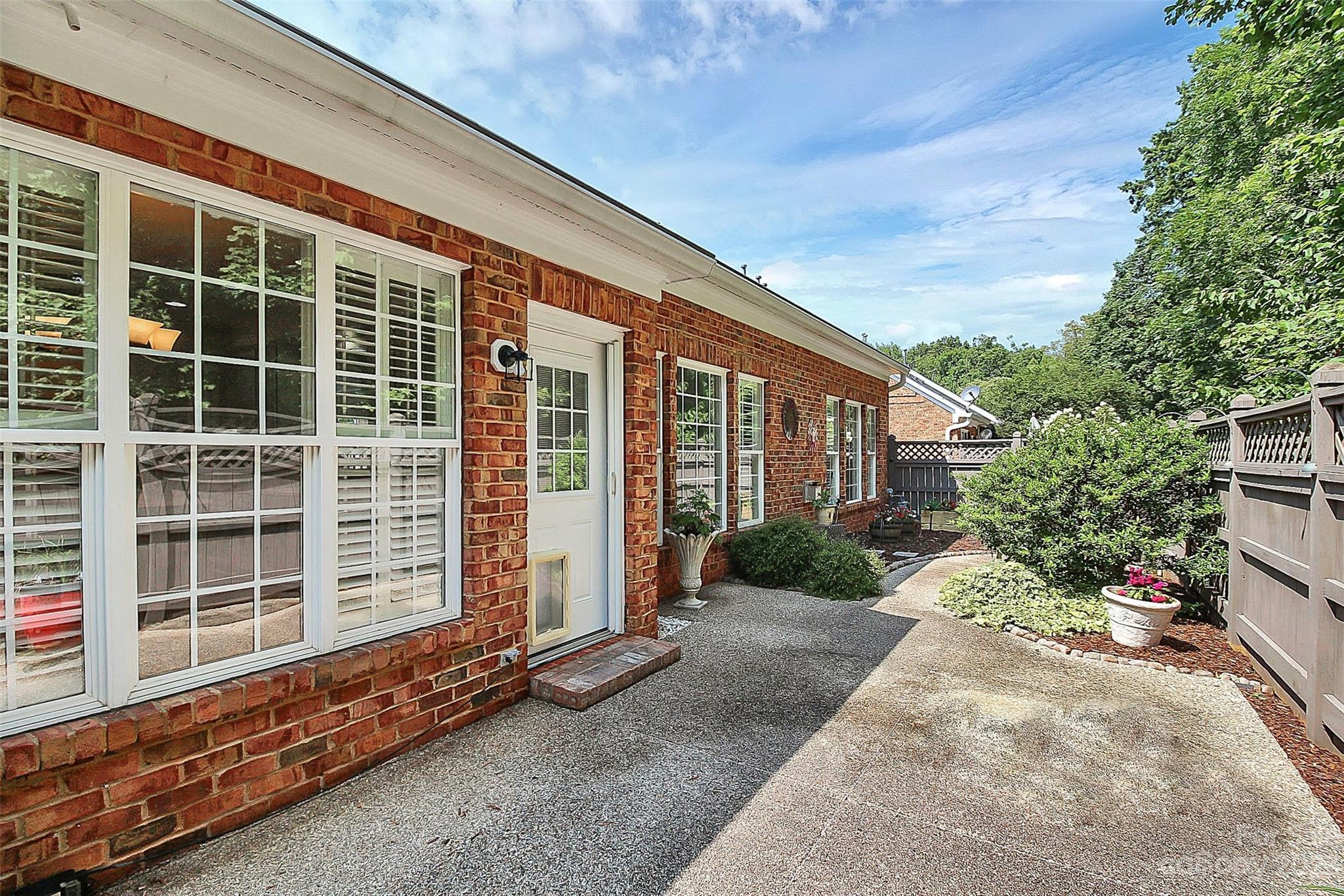218 Robinlynn Road Matthews, NC 28105 - Photo 20 of 24 a front view of a house with a yard