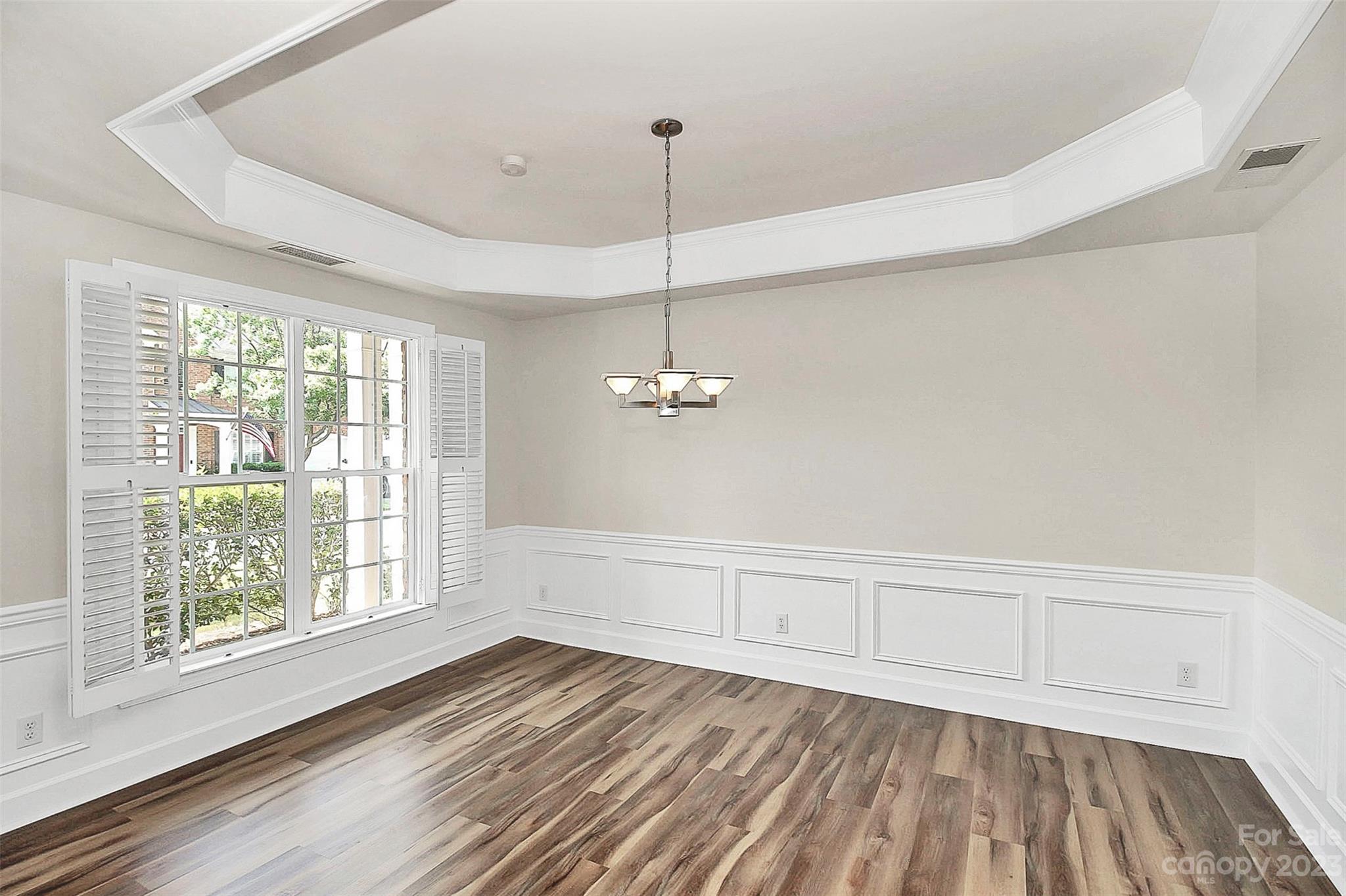 218 Robinlynn Road Matthews, NC 28105 - Photo 7 of 24 a view of empty room with wooden floor and fan