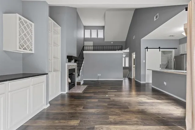a kitchen with a sink stove and cabinets