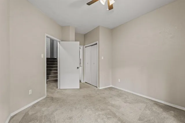 a bathroom with a granite countertop bathtub shower sink mirror vanity and toilet