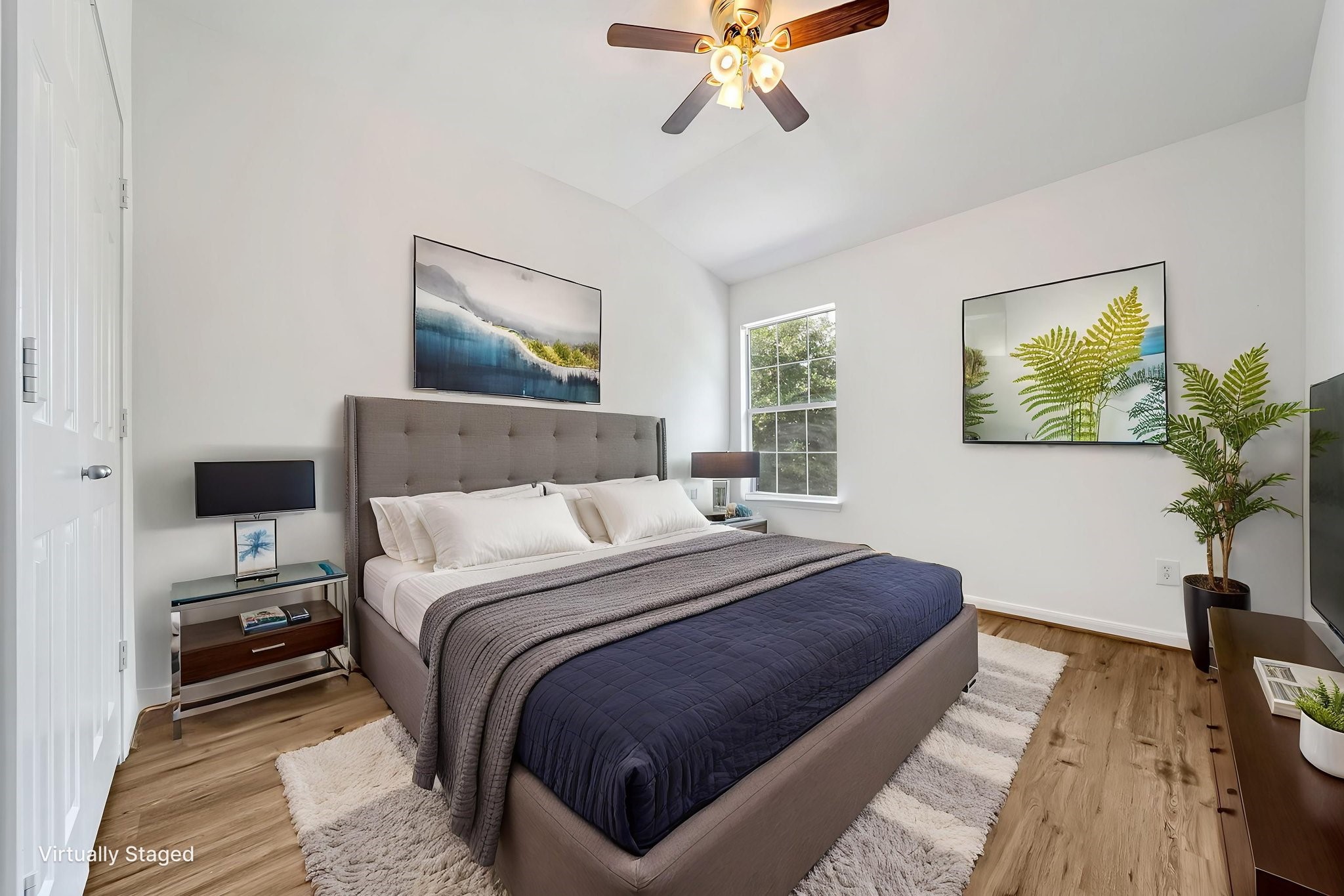 23526 Whispering Maple Drive Spring, TX 77373 - Photo 19 of 26 a bedroom with bed and wooden floor