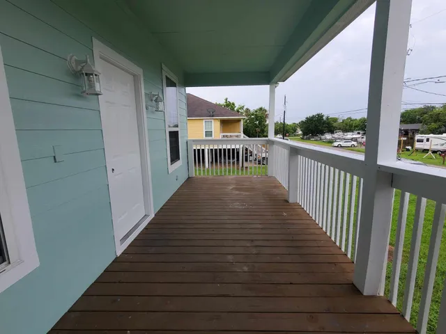 a view of balcony with furniture