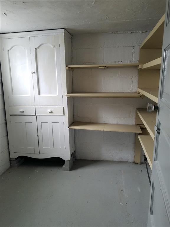 312 Trimble Street Carnegie, PA 15106 - Photo 11 of 15 a view of cabinets and utility room with racks on the wall