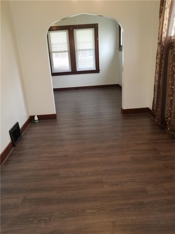 312 Trimble Street Carnegie, PA 15106 - Photo 3 of 15 an empty room with wooden floor and windows