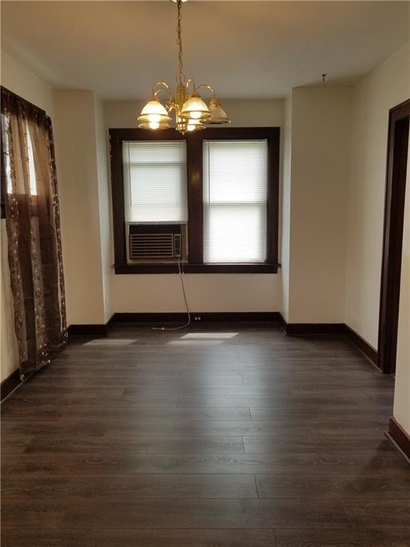312 Trimble Street Carnegie, PA 15106 - Photo 7 of 15 an empty room with wooden floor chandelier and windows