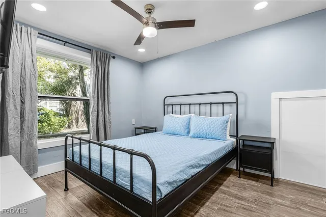 a bedroom with a bed and a window