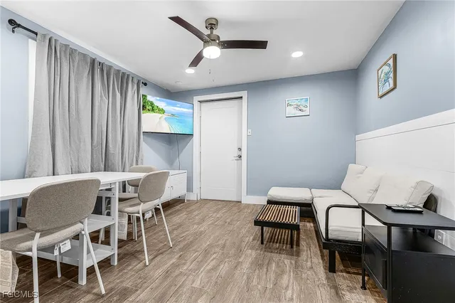 a dining room with furniture and window