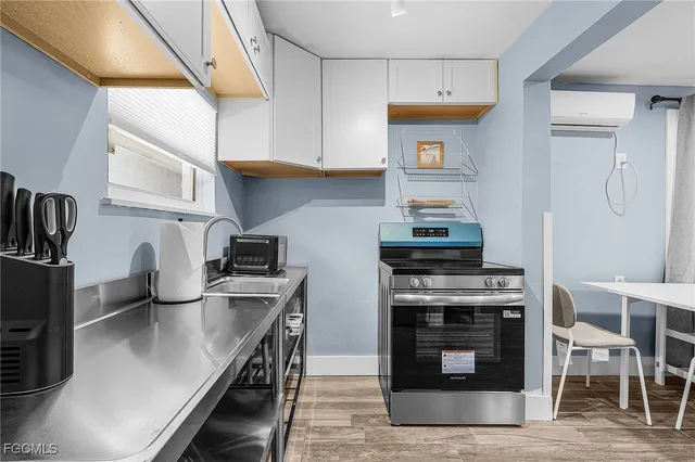 a kitchen with stainless steel appliances granite countertop a stove and a sink