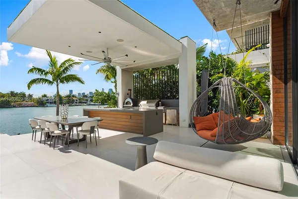 a view of a patio with couches and potted plants