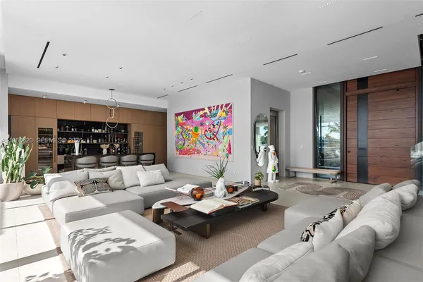 a living room with furniture and lamp