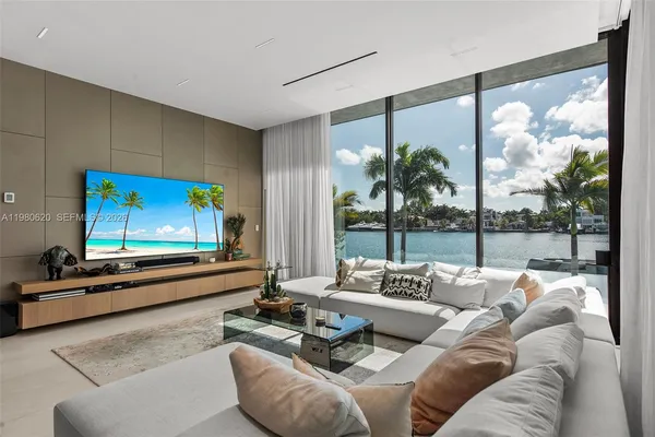 a living room with furniture and a flat screen tv