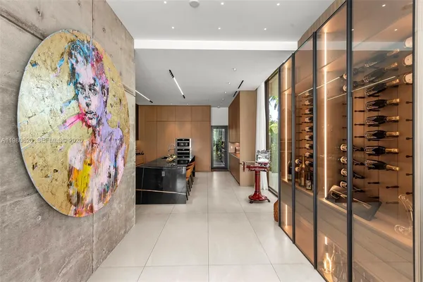 a kitchen with stainless steel appliances kitchen island granite countertop a stove a sink and a refrigerator