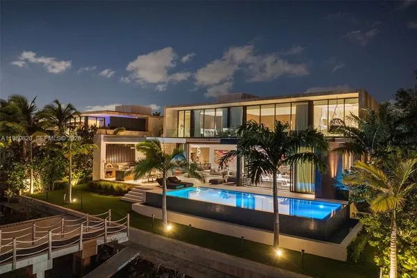 a view of swimming pool with outdoor seating