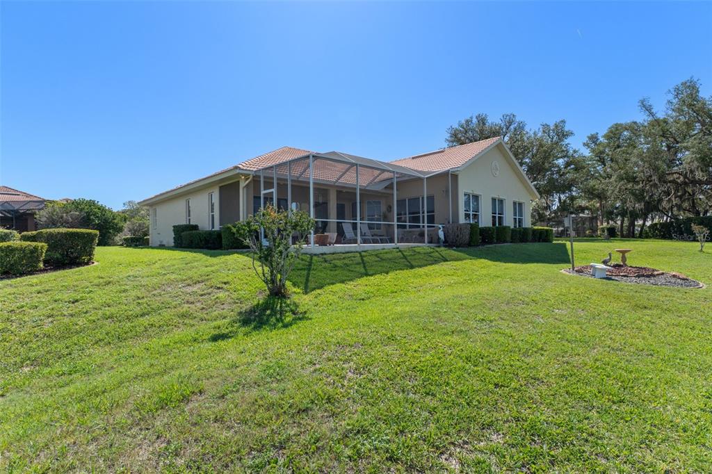 10081 Georgetown Court Weeki Wachee, FL 34613 - Photo 53 of 76 a view of a house with a yard and plants