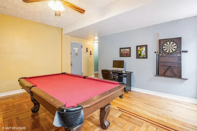 a room with pool table and flat screen tv