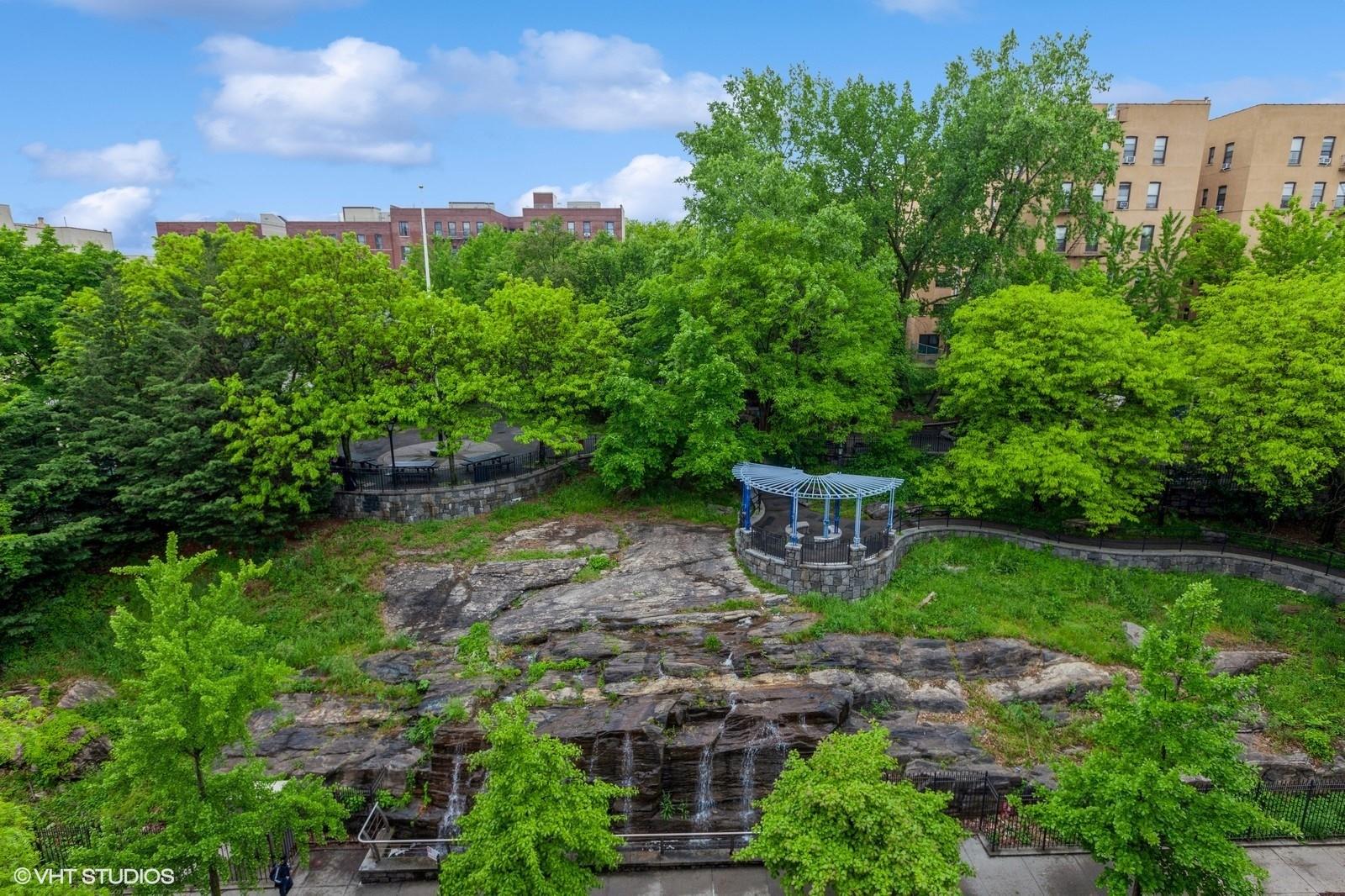 1670 Longfellow Avenue, Unit 6J Bronx, NY 10460 - Photo 14 of 15 a view of a garden with a bench in a garden