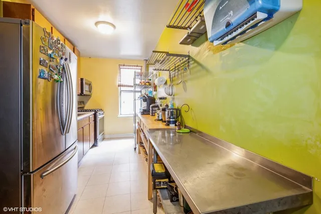 a view of a kitchen with appliances and a window