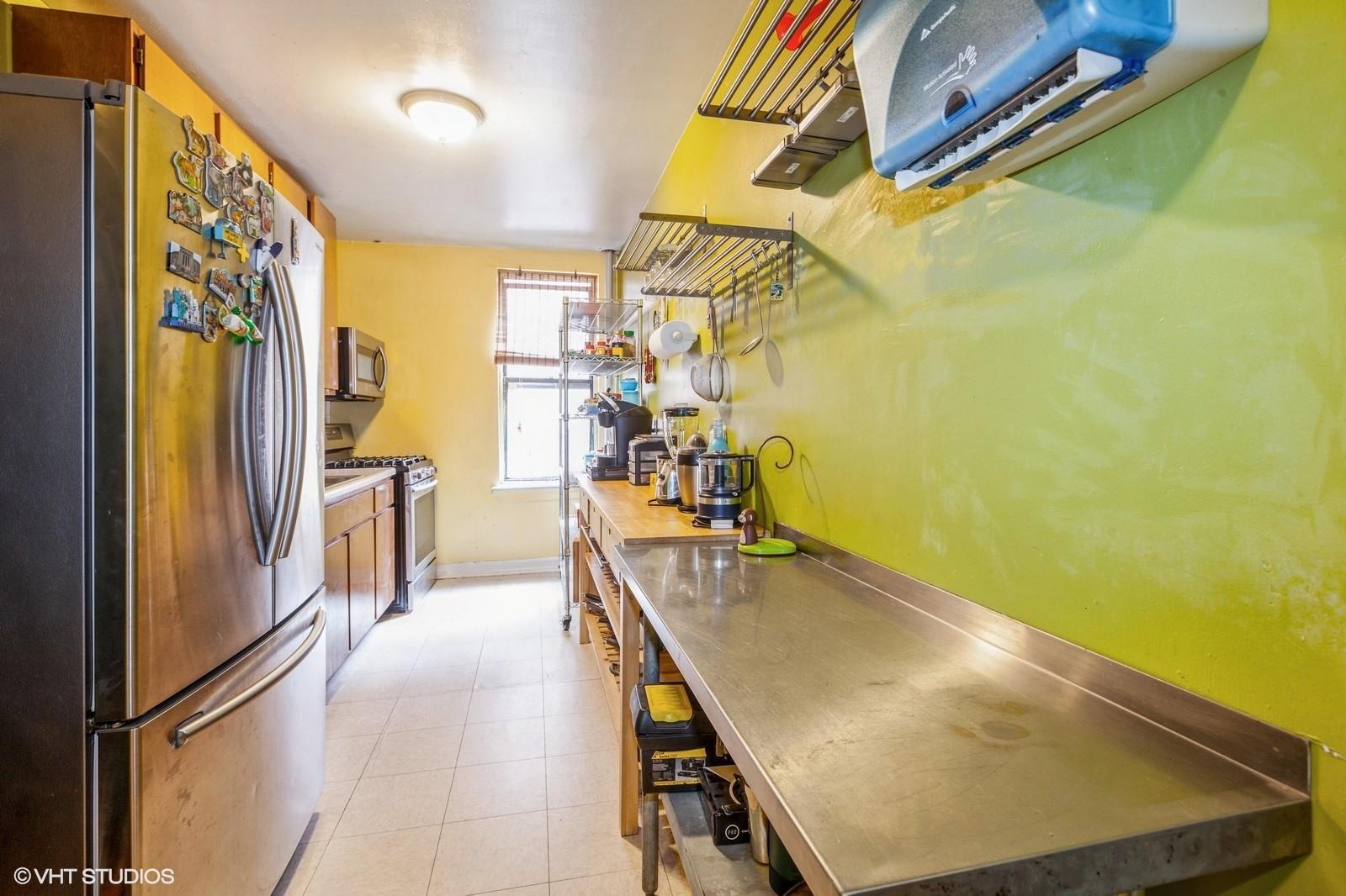 1670 Longfellow Avenue, Unit 6J Bronx, NY 10460 - Photo 8 of 15 a view of a kitchen with appliances and a window