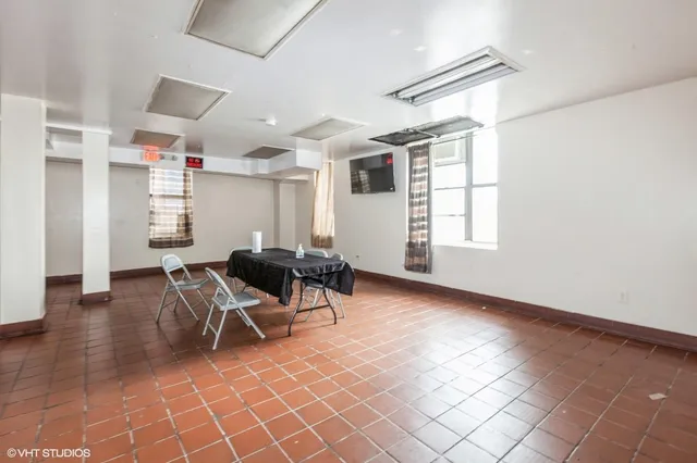 a view of a livingroom with furniture and window