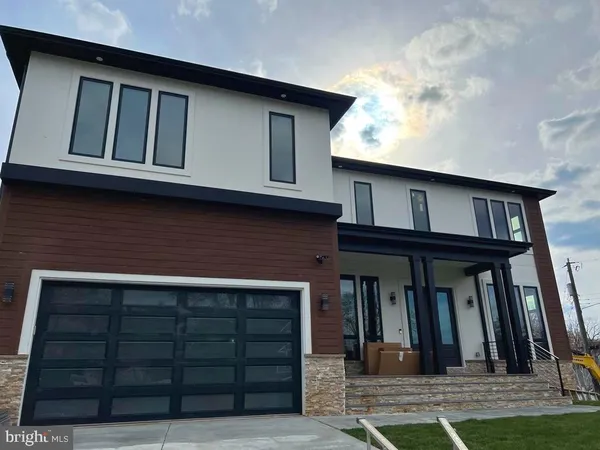 a view of a house with more windows and a yard