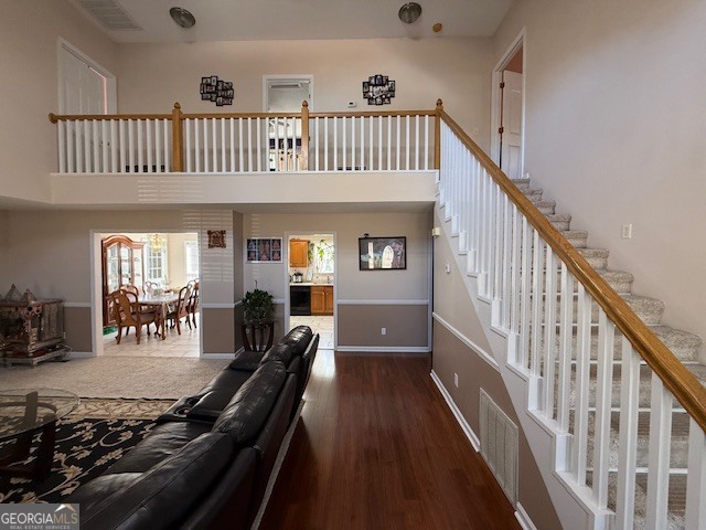 1407 Red Fox Trail, Unit 4 Tifton, GA 31793 - Photo 2 of 30 a view of staircase with lots of frames on wall and a window