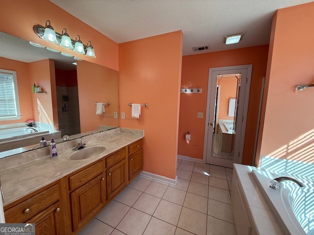 1407 Red Fox Trail, Unit 4 Tifton, GA 31793 - Photo 21 of 30 a spacious bathroom with a double vanity sink and a mirror