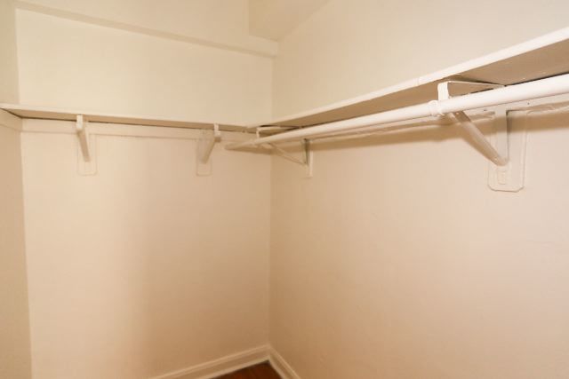 4604 North Beacon Street, Unit 3E Chicago, IL 60640 - Photo 12 of 13 a view of a room with racks on the wall