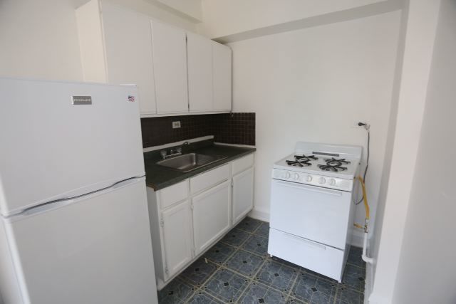 4604 North Beacon Street, Unit 3E Chicago, IL 60640 - Photo 2 of 13 a utility room with cabinets washer and dryer