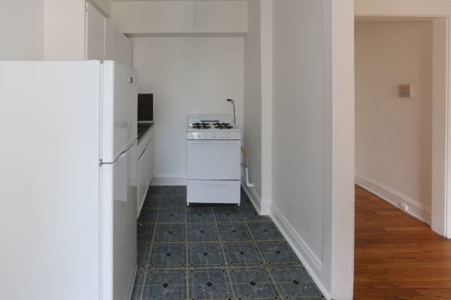 4604 North Beacon Street, Unit 3E Chicago, IL 60640 - Photo 4 of 13 a view of storage and utility room with refrigerator